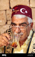 turkish-man-drinking-turkish-tea-in-fez-kaleici-antalya-turkey-FEB6R9-376032143.jpg