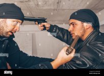 two-assulters-are-fighting-and-one-of-them-is-pointing-a-gun-on-his-parthers-head-2A5GXAR.jpg