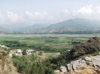 Gumbatuna_stupa_from_hill_top_with_river_swat_and_mount_ilam.jpg