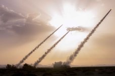 Long-range Multiple Launch Rocket Systems (MLRS) attached to the long-range MLRS battalion of ...jpg