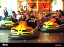 young-girls-having-on-fairground-bumper-cars-children-kids-enjoying-BRDDWH.jpg